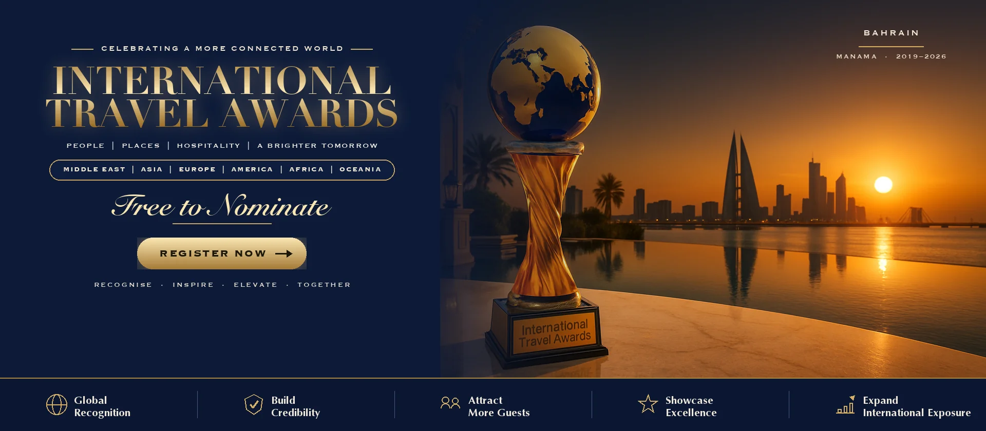 International Travel Awards trophy on a Dubai terrace at sunset with the Bahrain skyline behind it