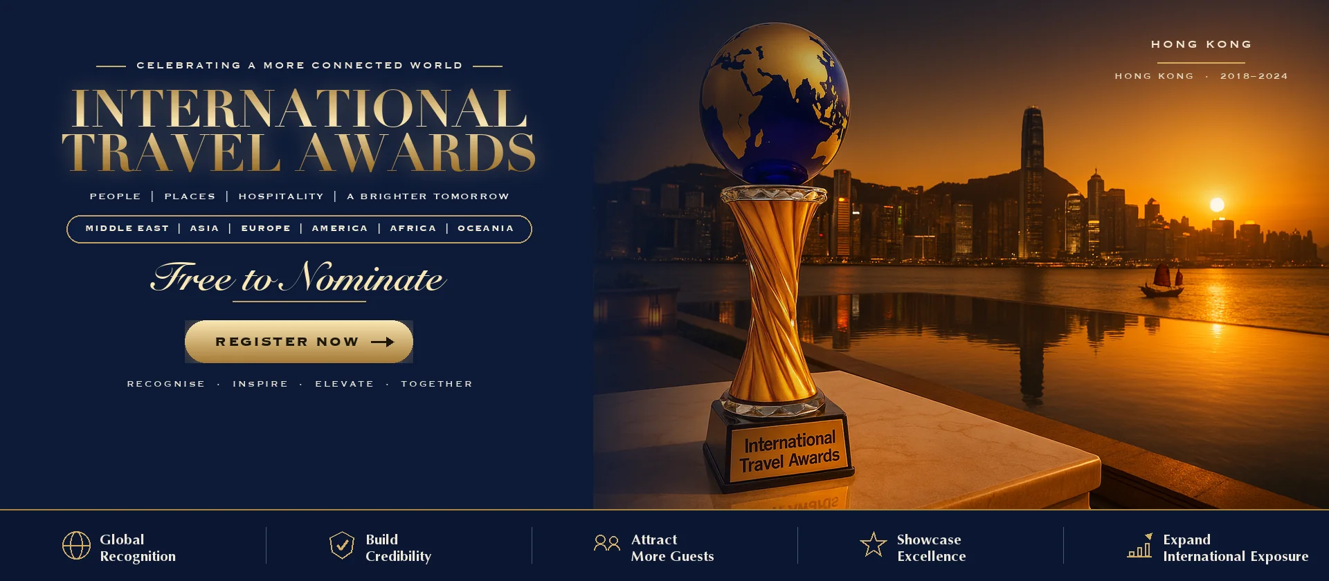 International Travel Awards trophy on a Dubai terrace at sunset with the Hong Kong skyline behind it
