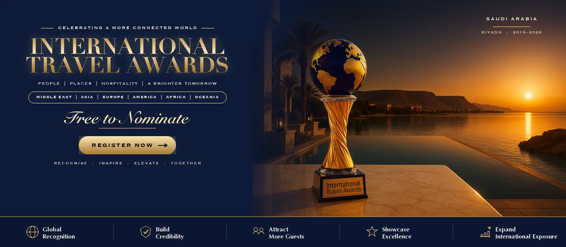International Travel Awards trophy on a Dubai terrace at sunset with the Saudi Arabia skyline behind it